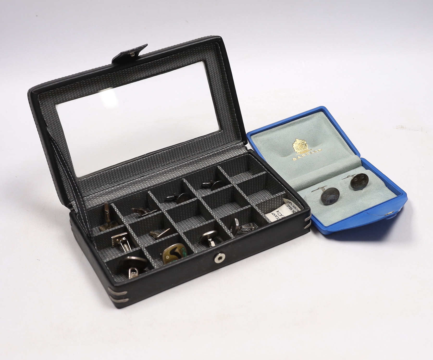 Six assorted pairs of white metal cufflinks, three stamped 925 and one silver pair by Garrard & Co, in original box.